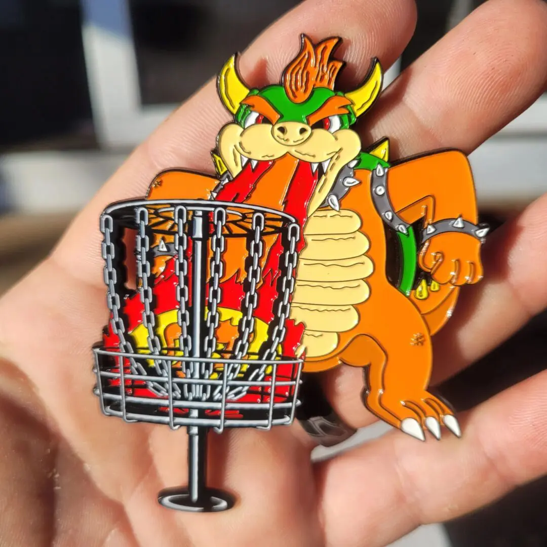 A person holding a pin of bowser and a basket