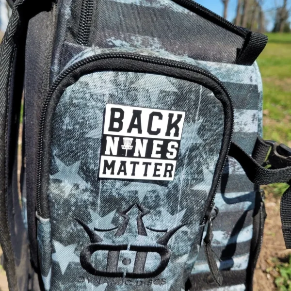 A backpack with a sticker on it.